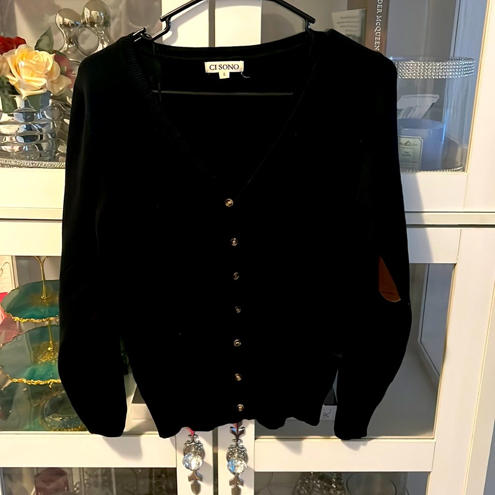 This beautiful black cardigan with brown elbow patches that are suede patches